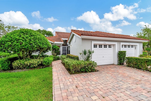 mediterranean / spanish-style house featuring a garage