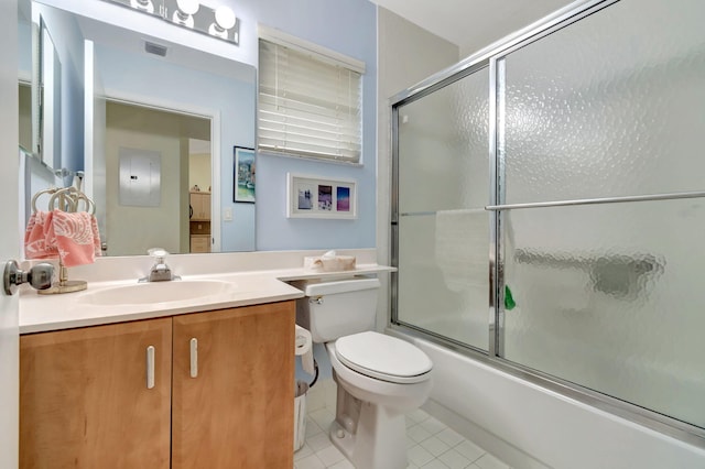 full bathroom with enclosed tub / shower combo, tile patterned floors, vanity, and toilet