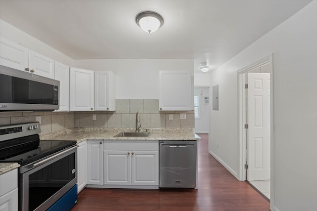 kitchen featuring white cabinets, stainless steel appliances, dark hardwood / wood-style floors, and sink