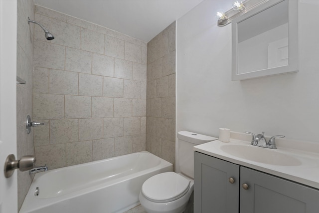 full bathroom with tiled shower / bath combo, vanity, and toilet