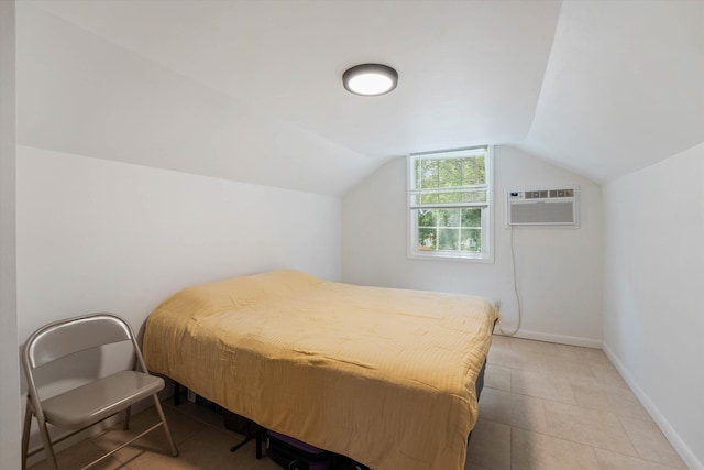 tiled bedroom with an AC wall unit and lofted ceiling