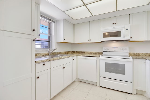 kitchen featuring white appliances and white cabinetry