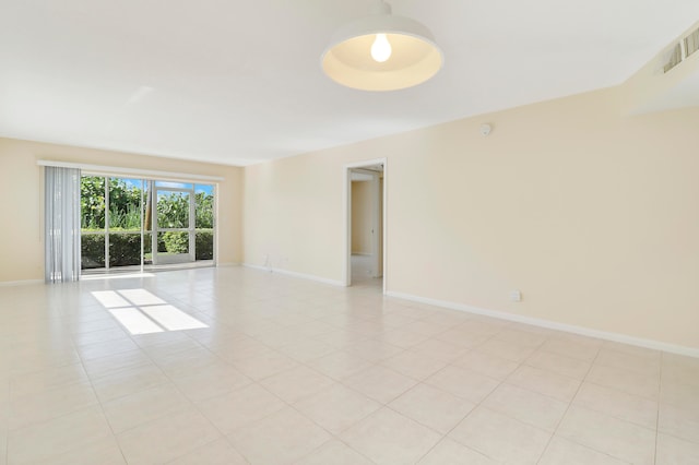 unfurnished room with light tile patterned floors