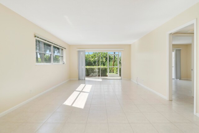 spare room featuring light tile patterned floors