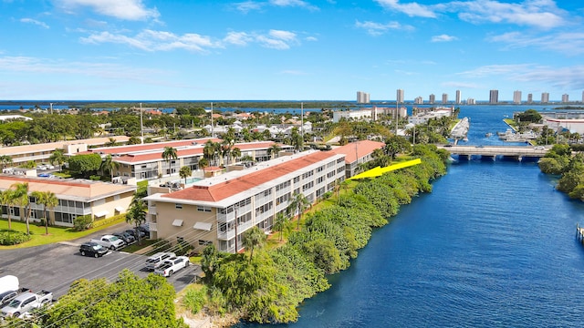 birds eye view of property with a water view