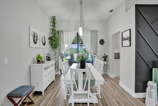 dining area featuring light wood-type flooring