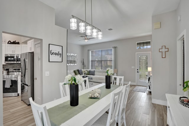 dining area with ceiling fan, plenty of natural light, and light hardwood / wood-style floors