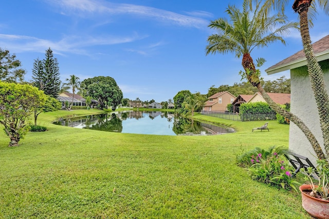 property view of water with fence and a residential view