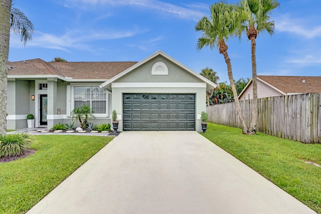 ranch-style home with a garage and a front yard