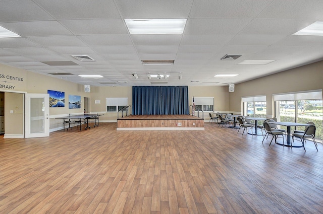 miscellaneous room featuring wood-type flooring and a paneled ceiling