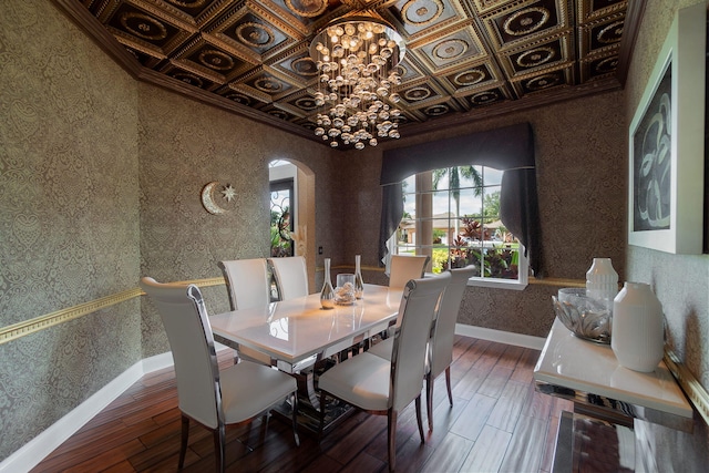 dining space with a chandelier, dark hardwood / wood-style flooring, and coffered ceiling