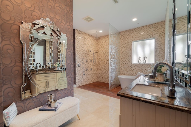 bathroom featuring vanity and a tile shower