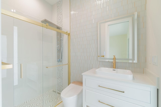 bathroom with toilet, vanity, tile walls, and walk in shower