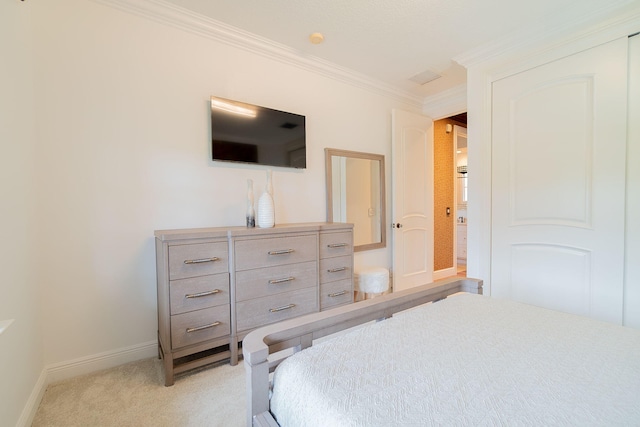 carpeted bedroom featuring crown molding