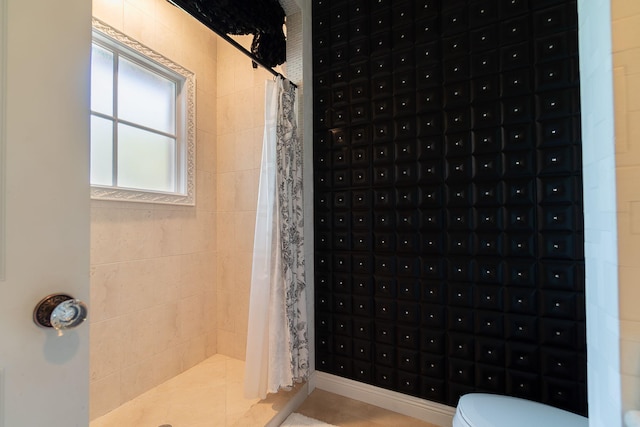 bathroom featuring tile patterned floors, curtained shower, and a mail area