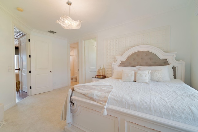 bedroom with ensuite bathroom, crown molding, light carpet, and an inviting chandelier