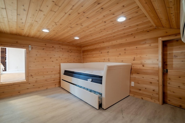 unfurnished bedroom featuring light wood-type flooring, wooden ceiling, lofted ceiling, and wood walls