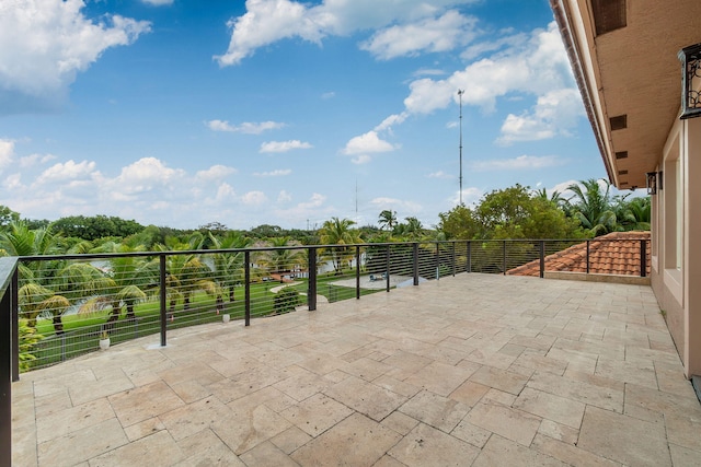 view of patio featuring a balcony