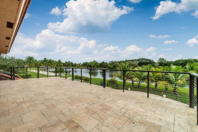 view of patio featuring a water view