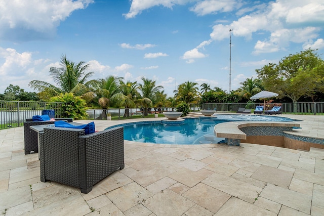 view of swimming pool featuring a patio