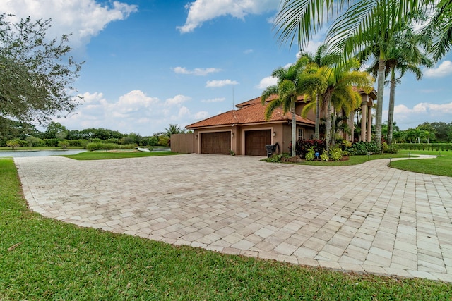 view of home's exterior featuring a yard and a garage