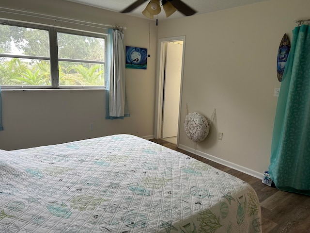 bedroom featuring wood-type flooring and ceiling fan