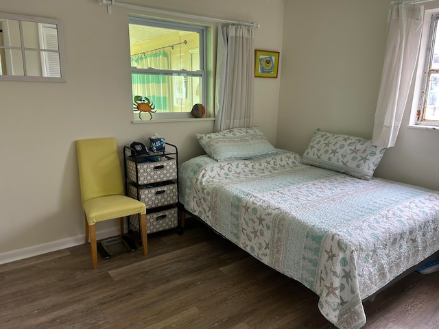 bedroom featuring dark hardwood / wood-style flooring