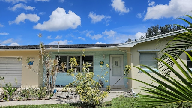 doorway to property featuring a garage