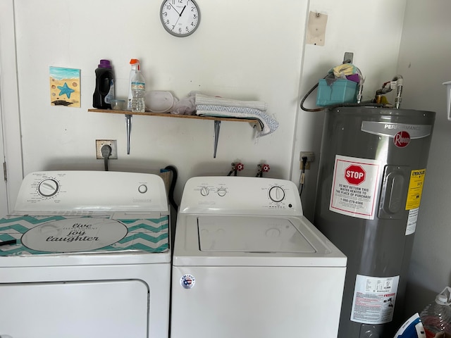 washroom featuring water heater and washer and dryer