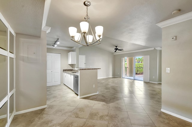 kitchen featuring white cabinetry, rail lighting, dark stone counters, hanging light fixtures, and crown molding