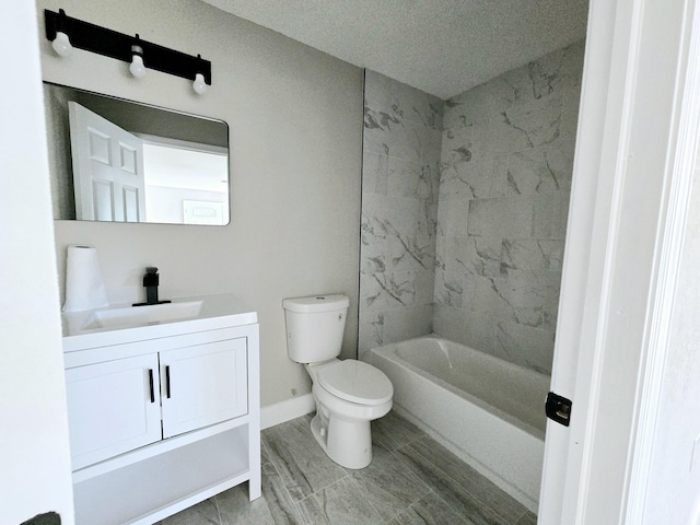 full bathroom with a textured ceiling, vanity, toilet, and tiled shower / bath