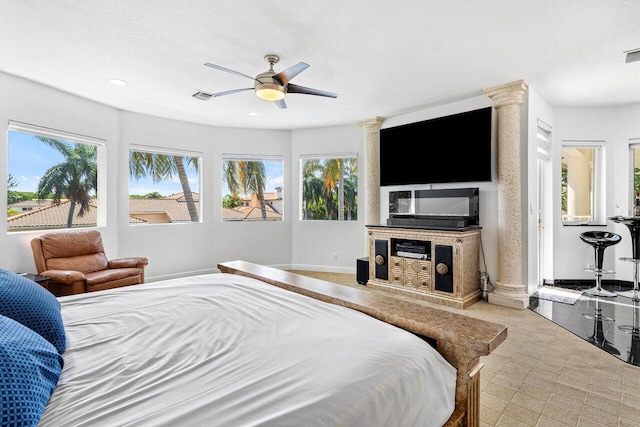 bedroom featuring ceiling fan and a textured ceiling