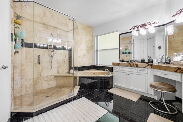 bathroom featuring separate shower and tub and vanity