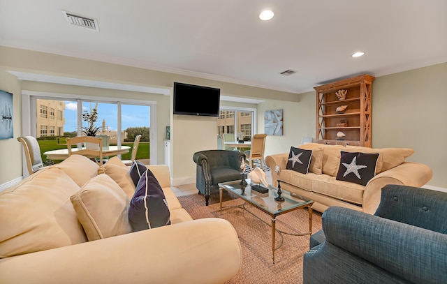 living room featuring crown molding, light tile patterned flooring, visible vents, and recessed lighting