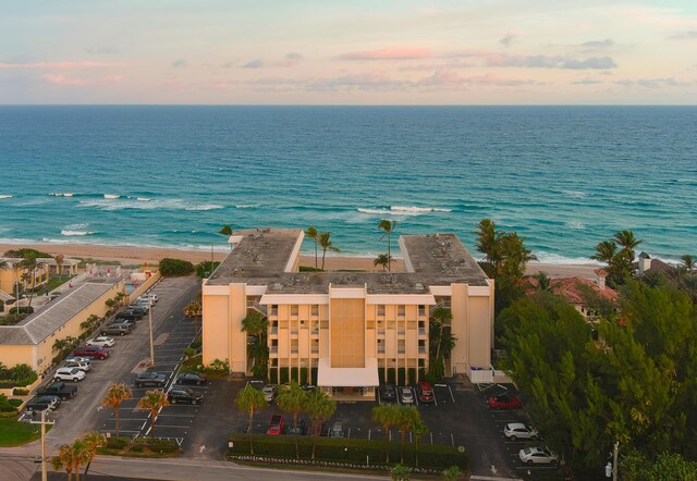 aerial view at dusk with a water view