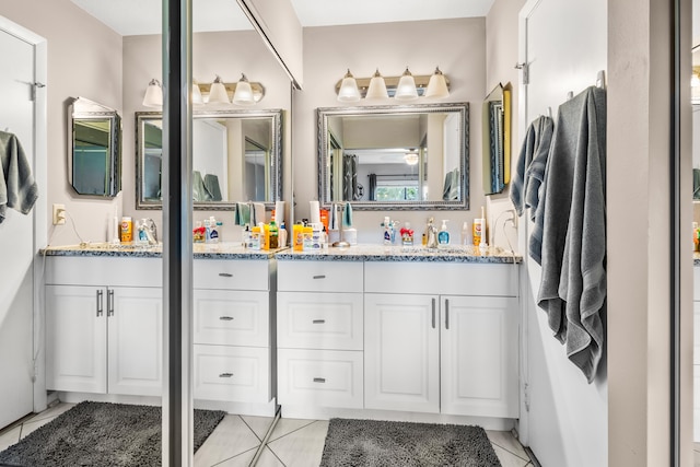 bathroom featuring tile patterned floors and vanity