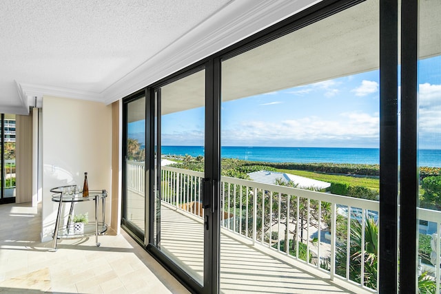 balcony featuring a water view