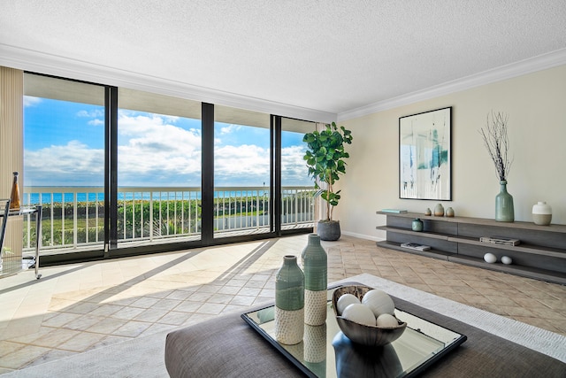 tiled living room featuring crown molding, a water view, a wall of windows, and a textured ceiling