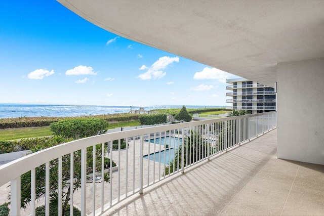 balcony featuring a water view