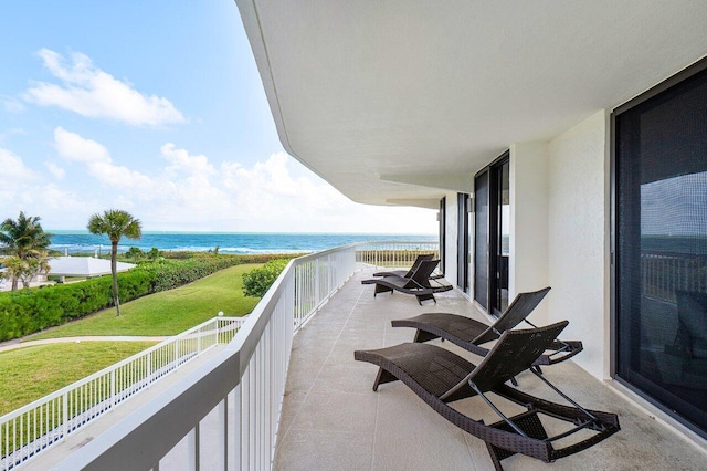 balcony featuring a water view