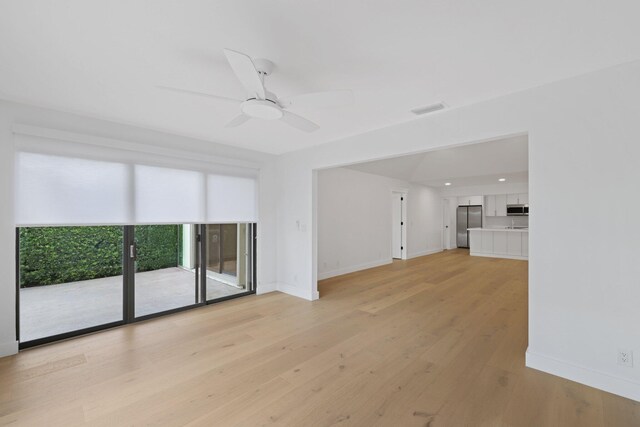 interior space with ceiling fan