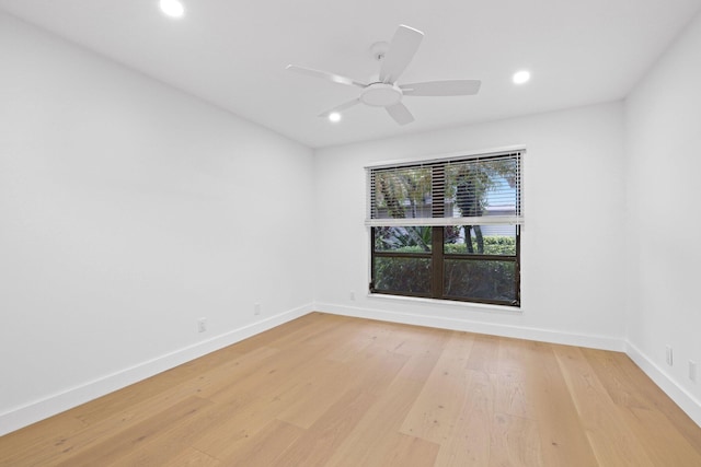 unfurnished room featuring light wood-type flooring and ceiling fan