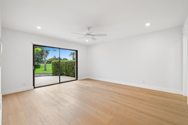 spare room featuring light hardwood / wood-style floors and ceiling fan