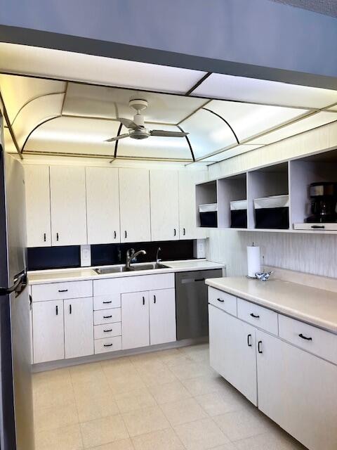 kitchen with white cabinetry, ceiling fan, appliances with stainless steel finishes, and sink