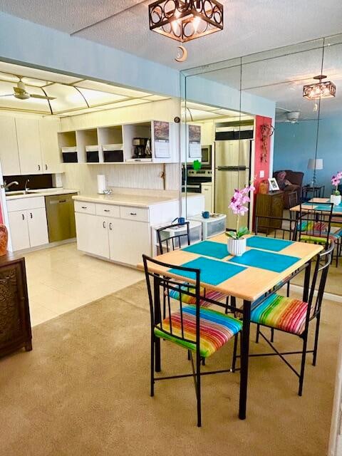 interior space with a textured ceiling and sink