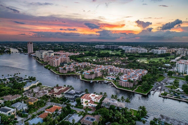 aerial view at dusk with a water view