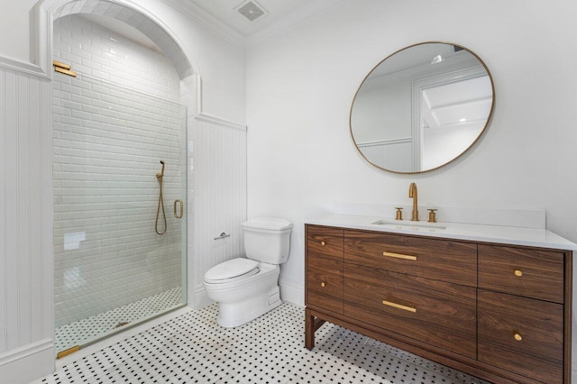 bathroom with vanity, toilet, an enclosed shower, and ornamental molding