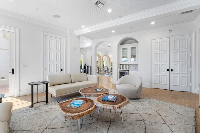 living room with wine cooler and ornamental molding