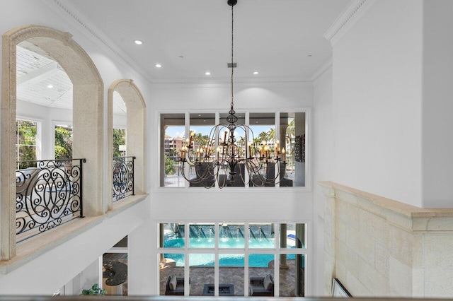 room details with an inviting chandelier and ornamental molding