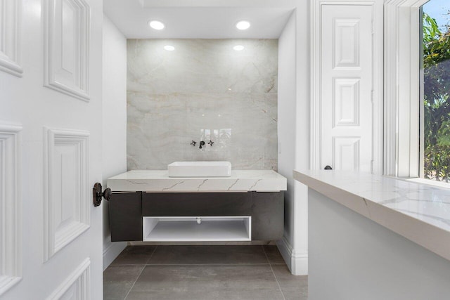 bathroom with tile patterned flooring, plenty of natural light, and vanity